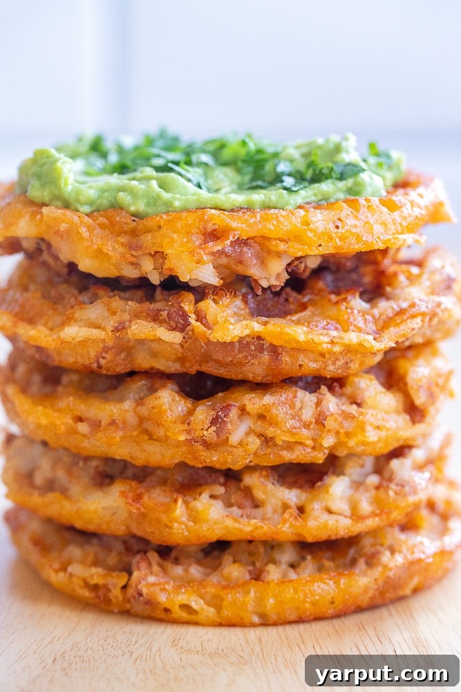 Savory Cheesy Rice and Bean Waffles 6 A finished Cheesy Rice and Bean Waffle being lifted from a waffle maker with a spatula.
