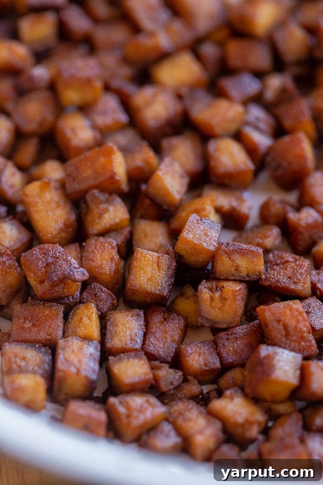 Ultimate Crispy Vegan Pancetta 7 close up of crispy tofu pancetta in a frying pan
