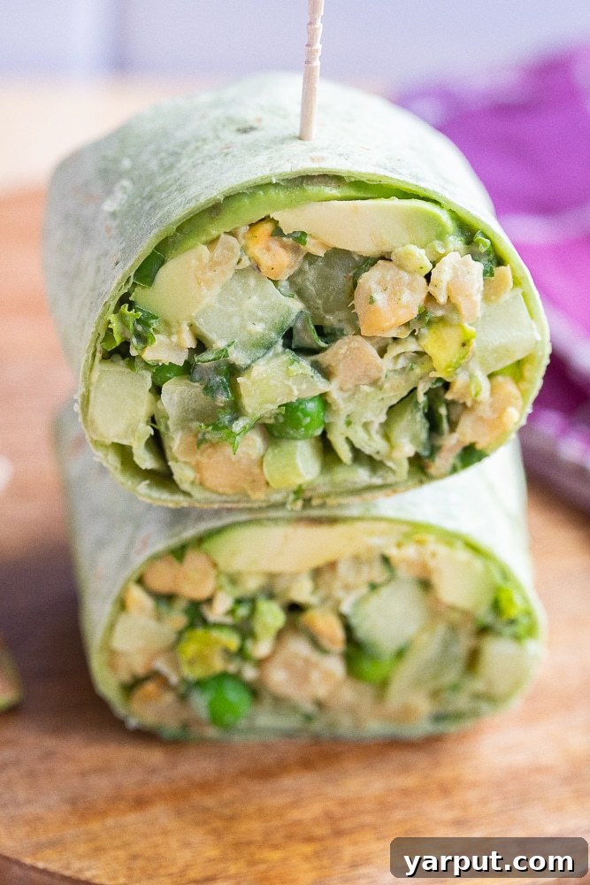 Emerald Goddess Chickpea Rolls 6 a close-up view of a perfectly cut green goddess wrap, revealing its fresh, colorful filling
