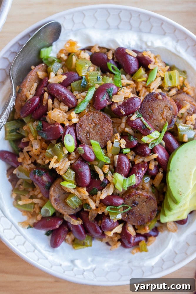 Skillet Veggie Sausage & Red Bean Rice 7 close up of a bowl with red beans and rice with greek yogurt