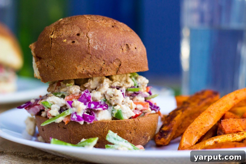 Vibrant Asian Tofu Salad Sandwiches 11 Hand holding an Asian Tofu Salad Sandwich