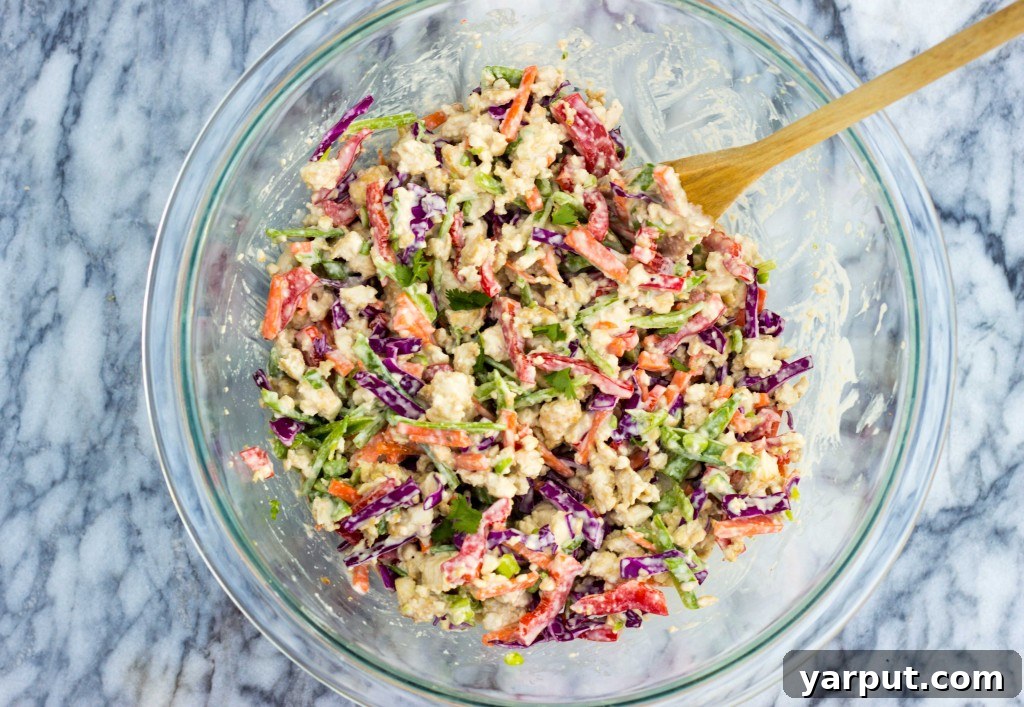 Vibrant Asian Tofu Salad Sandwiches 7 Freshly made Asian Tofu Salad Sandwiches on a wooden board