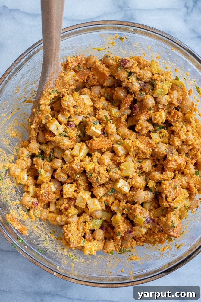 Spicy Buffalo Sweet Potato & Chickpea Power Bowls 5 A close-up shot of the finished Buffalo Sweet Potato Chickpea Salad with feta and couscous, ready to be enjoyed.