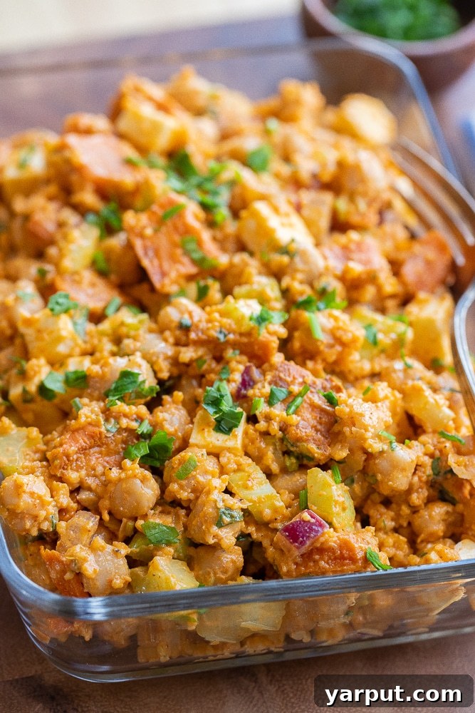 Spicy Buffalo Sweet Potato & Chickpea Power Bowls 6 A close-up of a meal prep container filled with the vegetarian buffalo chickpea salad, ready to eat.