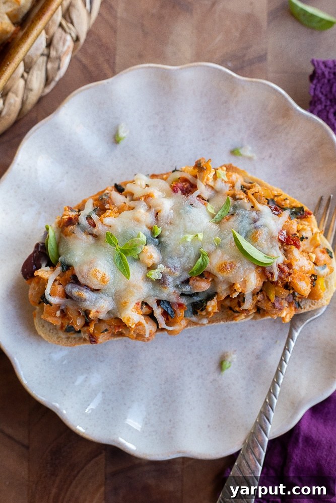Your Healthy Vegetarian Meal Plan for Week 12 4 Tuscan White Bean Toast topped with fresh herbs and served on a plate