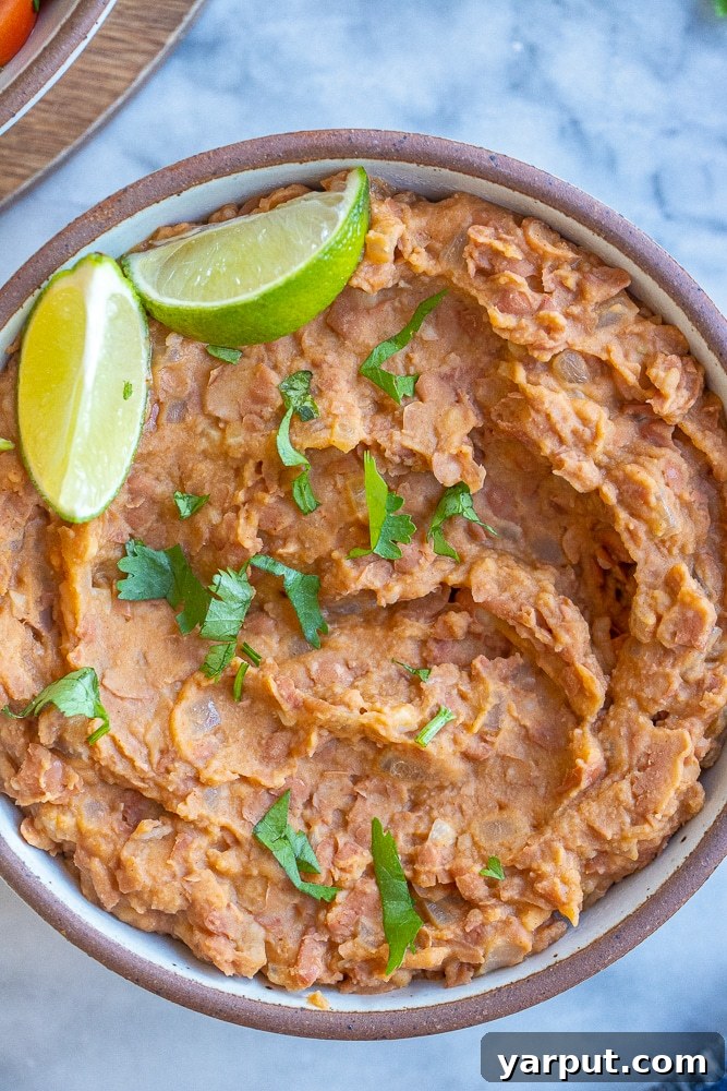 A World of Lentil Chickpea and Bean Delights 48 A bowl of easy homemade refried beans, smooth and creamy, ready to be served.