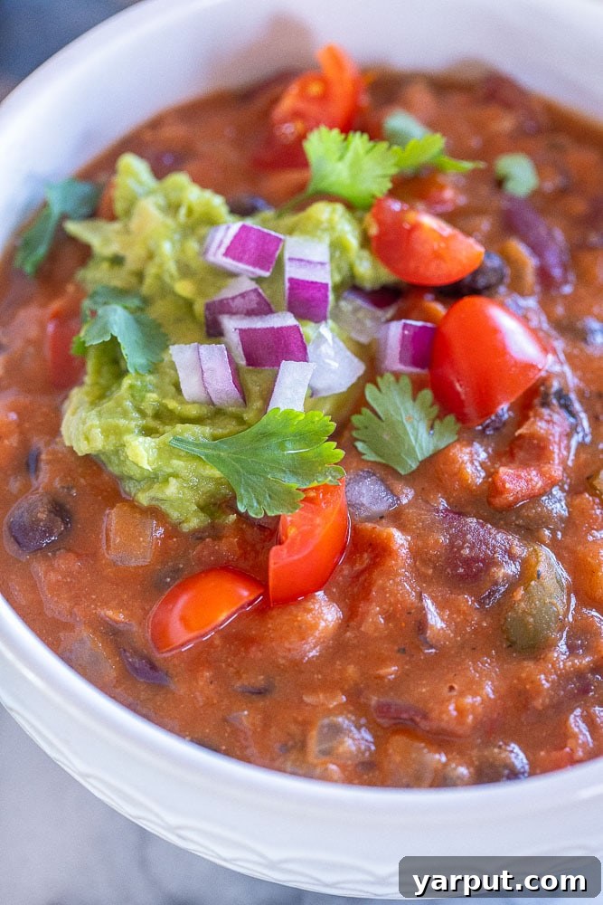 A World of Lentil Chickpea and Bean Delights 56 A rich and hearty bowl of the best vegan chili, topped with fresh avocado and cilantro.