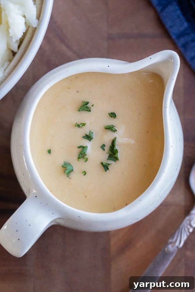 The Ultimate Vegetarian Gravy 2 close up of a saucer of vegetarian gravy, rich and creamy in texture