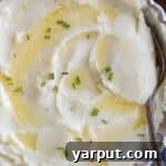 A bowl of the best creamy mashed potatoes, ready to be served.