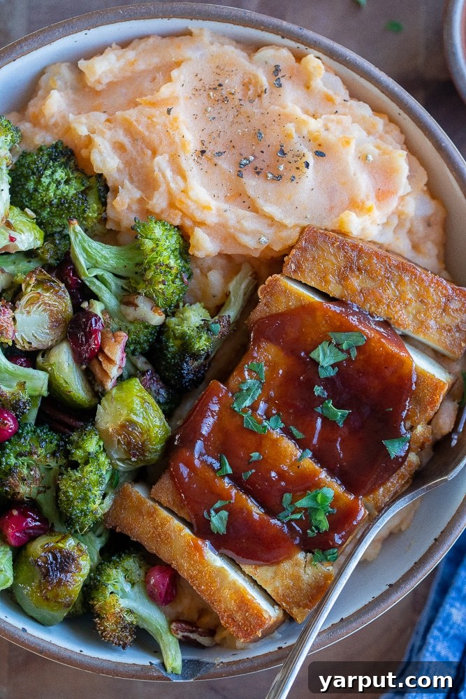 Vegetarian Thanksgiving Bowl with roasted potatoes, tofu, and cranberries