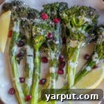 Roasted Broccolini with Lemon Tahini Dressing on a platter