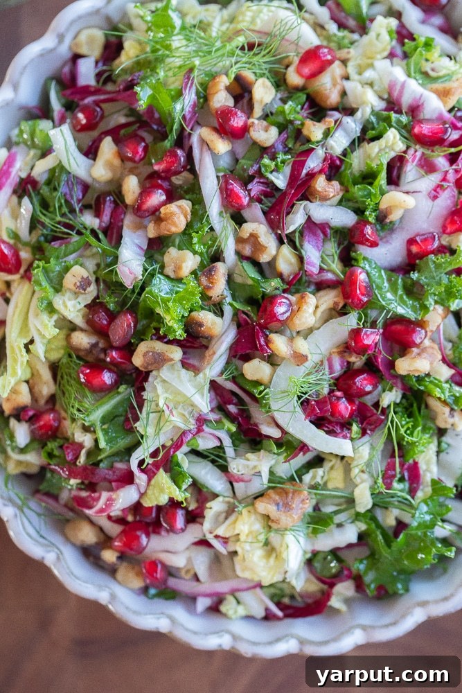 Merry & Bright Coleslaw 7 Close-up of the vibrant, colorful Christmas Coleslaw Salad on a white plate, showcasing its fresh ingredients and festive appeal.