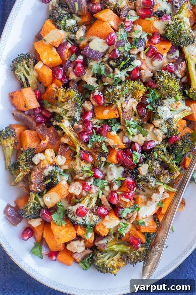40+ Festive Vegetarian Side Dishes 15 Roasted sweet potatoes and broccoli drizzled with a rich curry tahini sauce, presented beautifully on a plate.