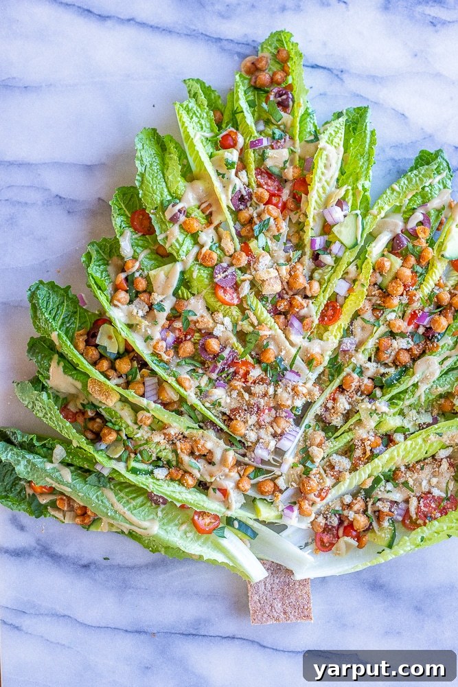 40+ Festive Vegetarian Side Dishes 21 A uniquely presented romaine lettuce Greek salad shaped like a Christmas tree, garnished with olives and tomatoes.