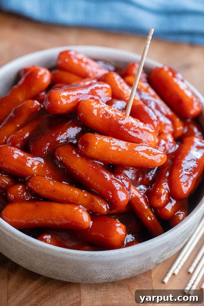 40+ Festive Vegetarian Side Dishes 5 Baby carrots coated in a sticky BBQ sauce, served as a vegetarian take on Little Smokies, with a festive feel.