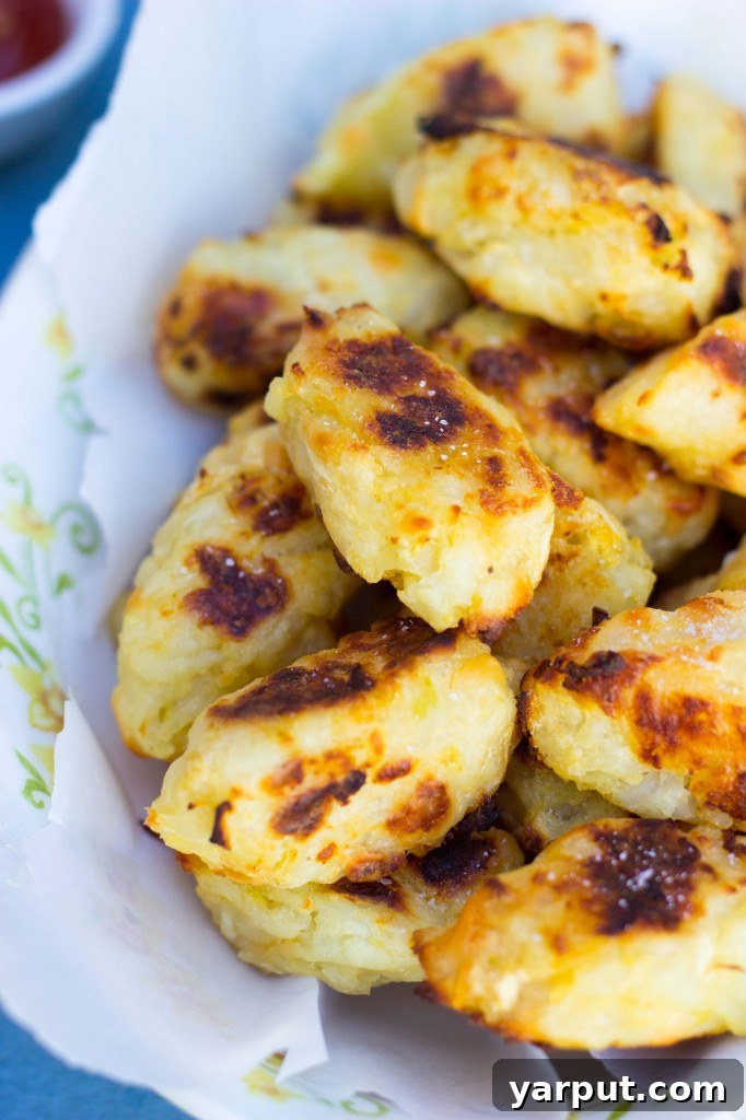 40+ Festive Vegetarian Side Dishes 46 Baked tater tots with smoked Gouda and green apple, golden brown and crispy, served with a dipping sauce.