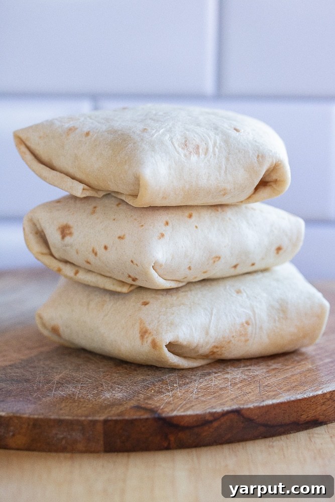 Southwestern Sunrise Wraps 6 three breakfast wraps folded up and stacked on top of eachother