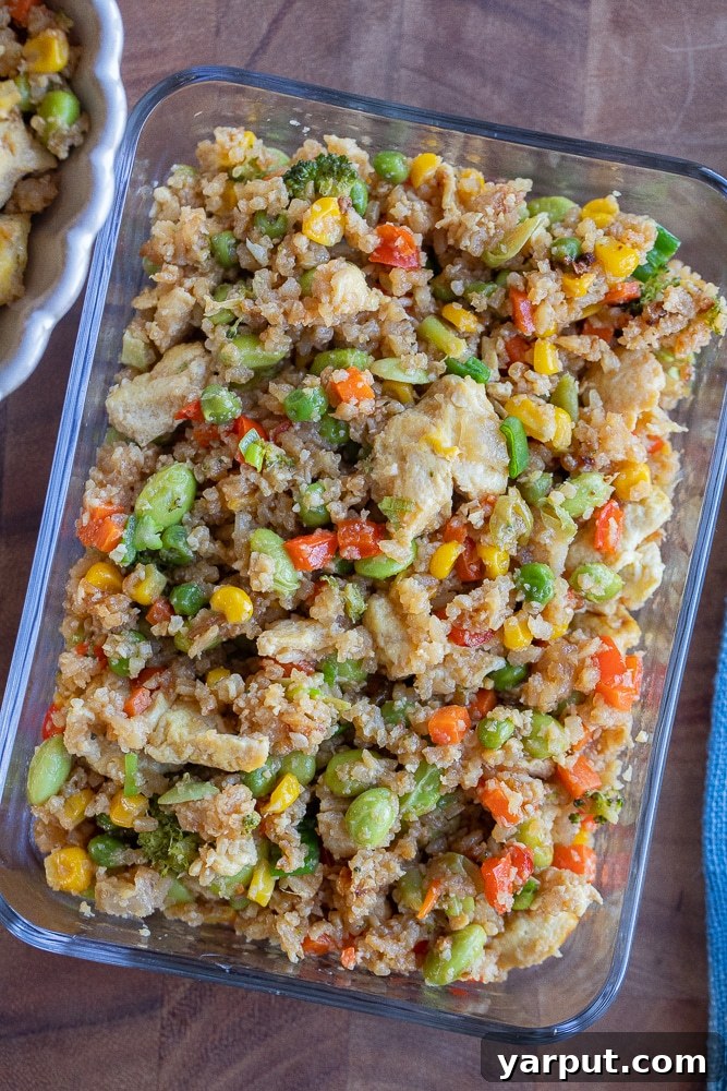 veggie packed fried rice in a clear meal prep container, ready to go