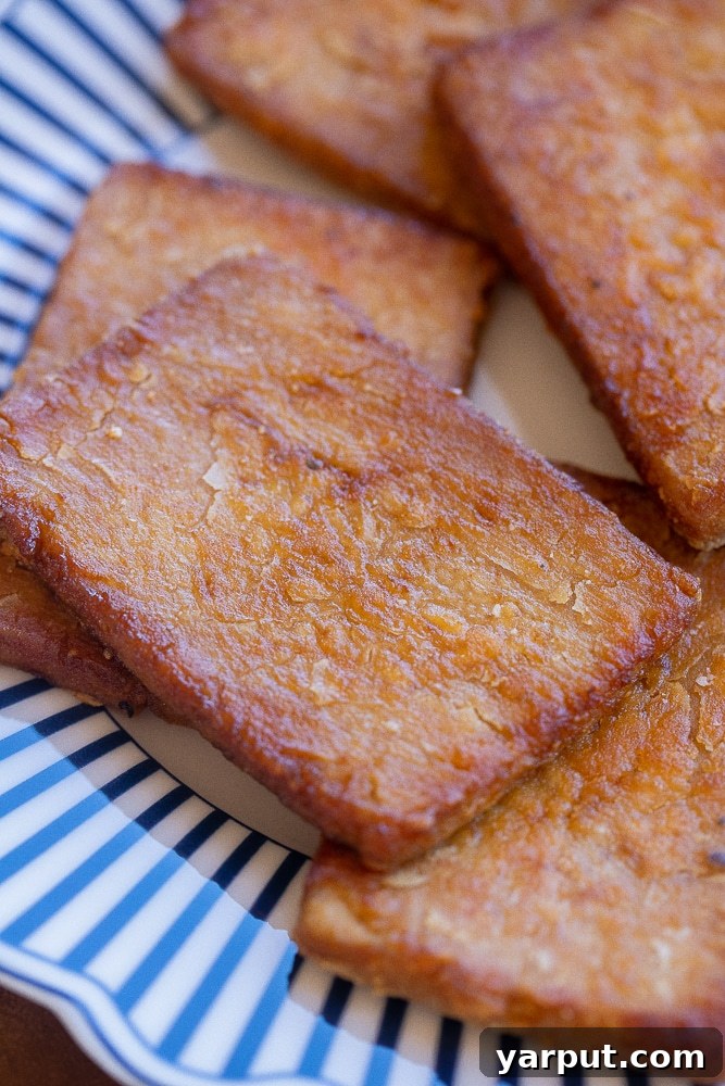 Crispy Smoky Tofu Bacon 7 close up of a slice of smoky tofu bacon