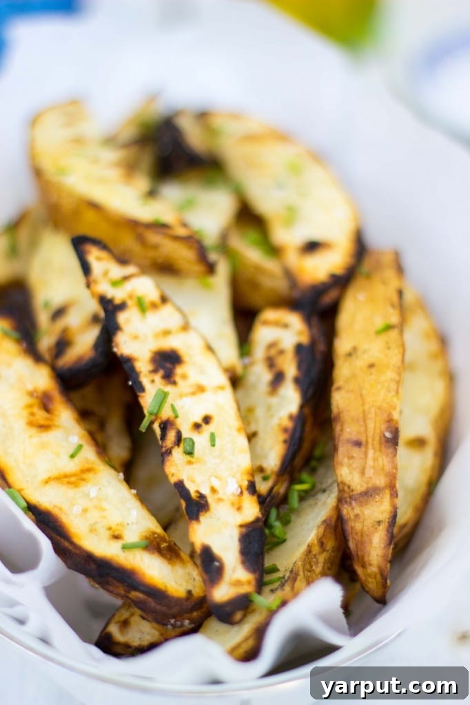 Zesty Salt and Vinegar Char-Grilled Potato Wedges 13 Salt & Vinegar Grilled Potato Wedges glistening with olive oil and coarse salt.