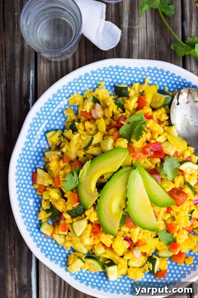 Calabacitas Orzo Salad with Zesty Cilantro Lime Dressing 11 Overhead shot of Calabacitas Orzo Salad in a rustic bowl, garnished with cilantro