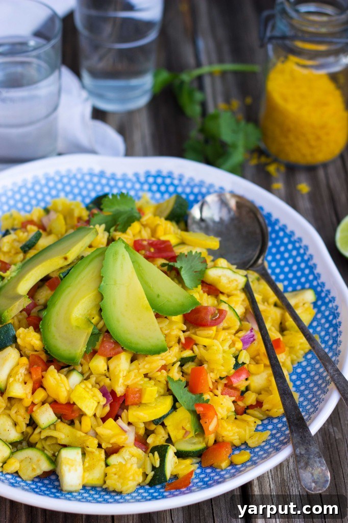 Calabacitas Orzo Salad with Zesty Cilantro Lime Dressing 10 A bowl of fresh Calabacitas Orzo Salad with a side of homemade dressing