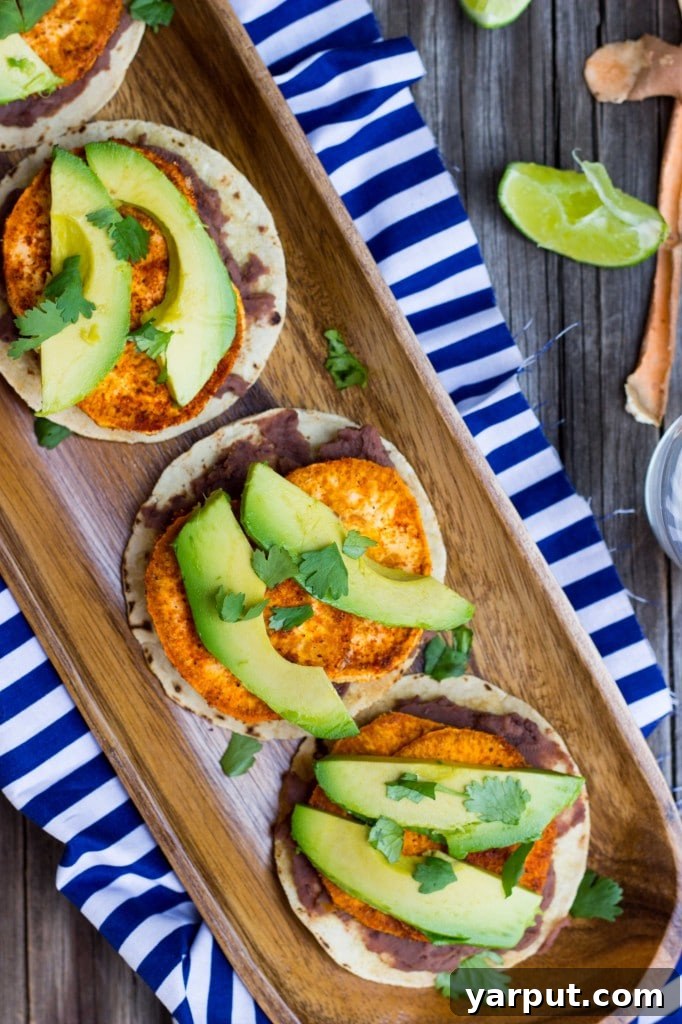 Perfect Roasted Sweet Potato, Black Bean and Avocado Tostadas 13 Multiple Roasted Sweet Potato, Black Bean & Avocado Tostadas on a serving plate