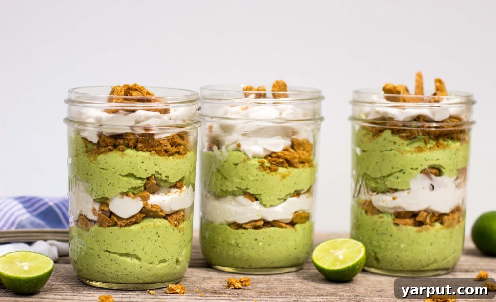 Overhead view of several vibrant green Lime Cheesecake Parfaits