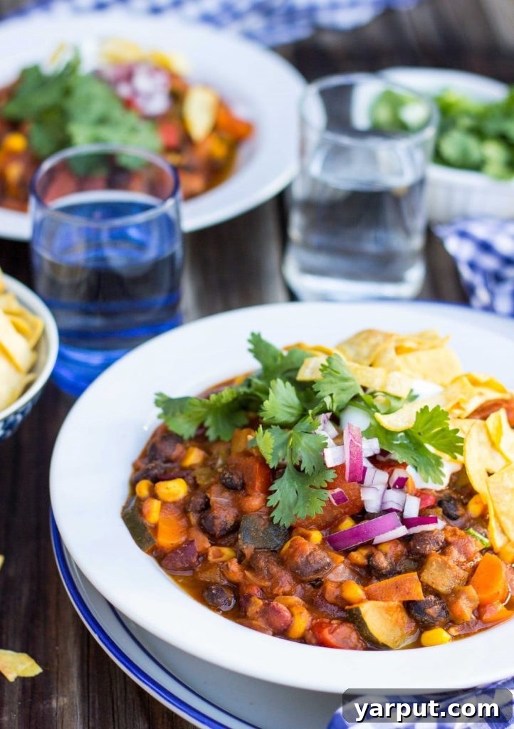 Hearty Triple Bean Vegetable Chili 12 Overhead shot of Three Bean Loaded Veggie Chili with various toppings