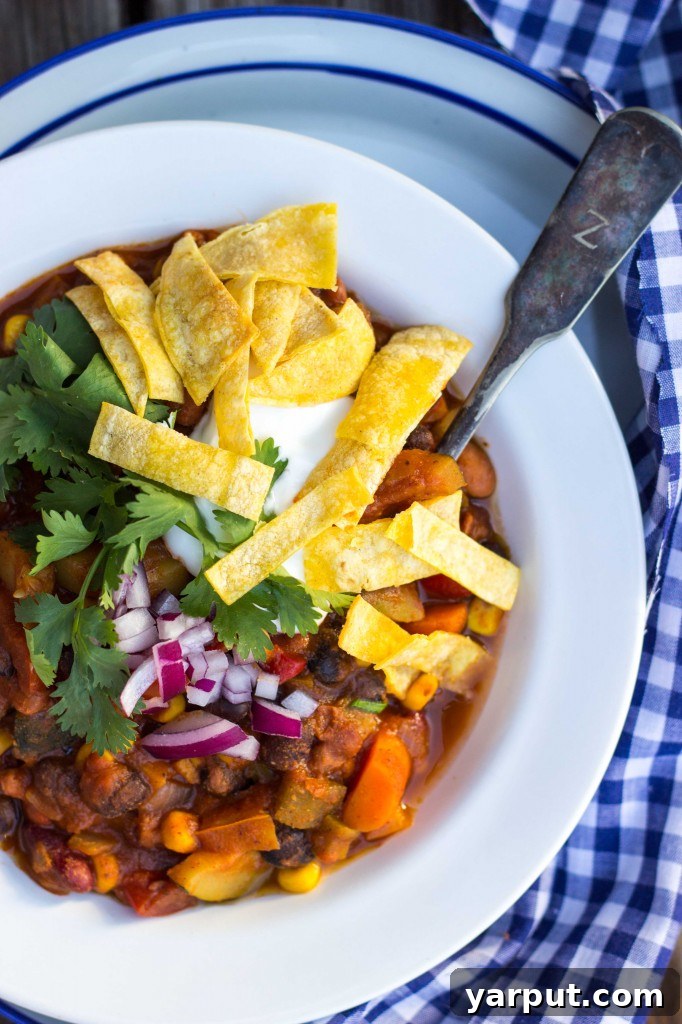 Hearty Triple Bean Vegetable Chili 9 A large pot of simmering Three Bean Loaded Veggie Chili