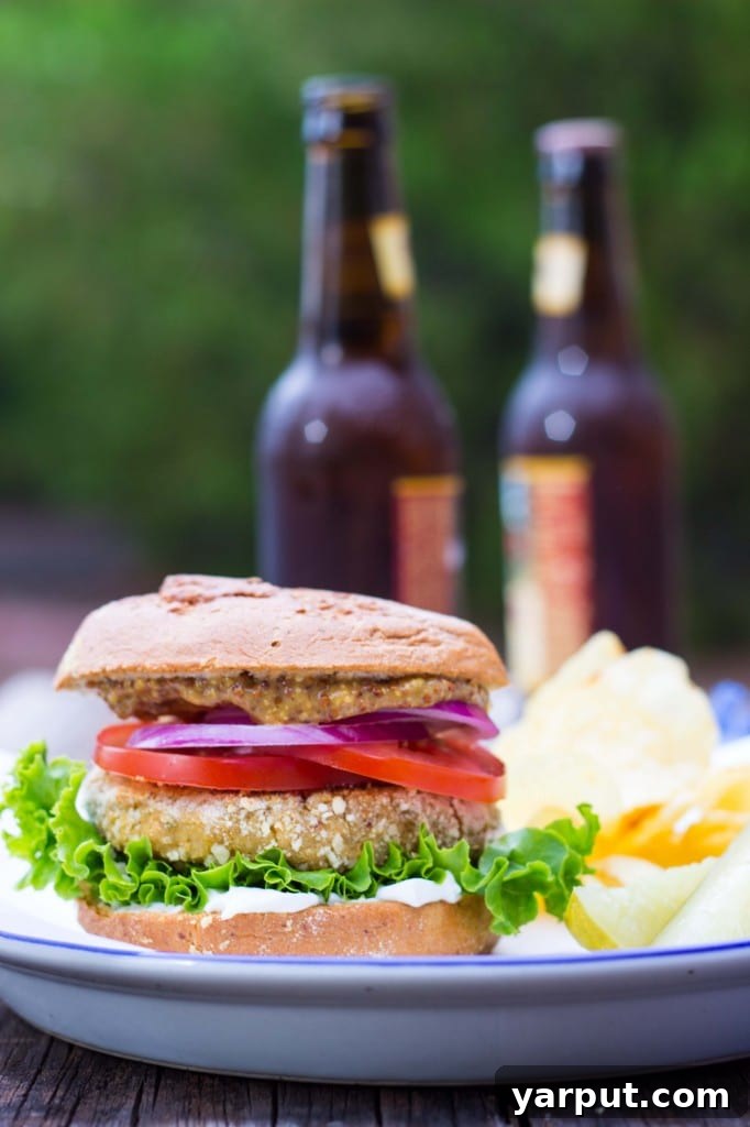 Side view of a tall vegan chicken patty sandwich