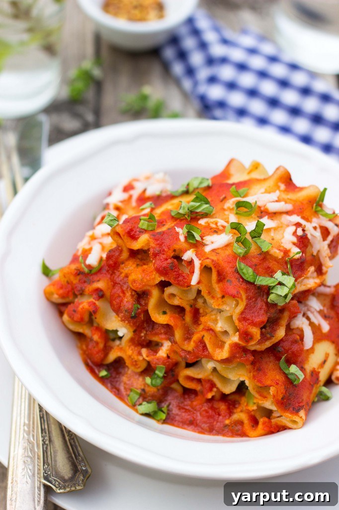 My Solo Week of Veggie Lasagna Rolls 12 Hand serving a Vegetable Lasagna Roll-Up
