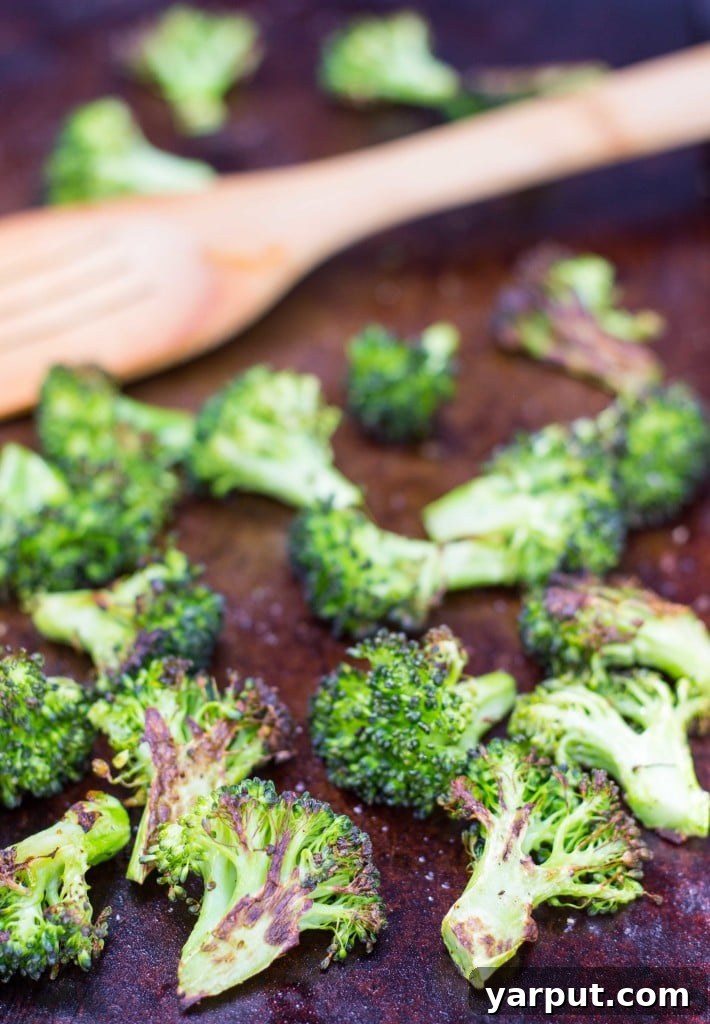 Roasted Broccoli & Lemon Hummus - A bowl of vibrant, freshly prepared hummus, garnished with herbs.
