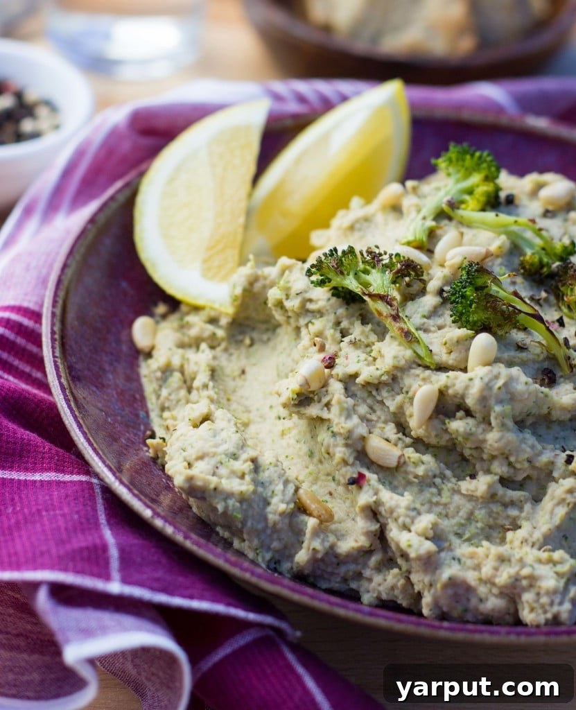 Roasted Broccoli & Lemon Hummus - A close-up of the hummus with a vibrant green hue, indicating the broccoli.