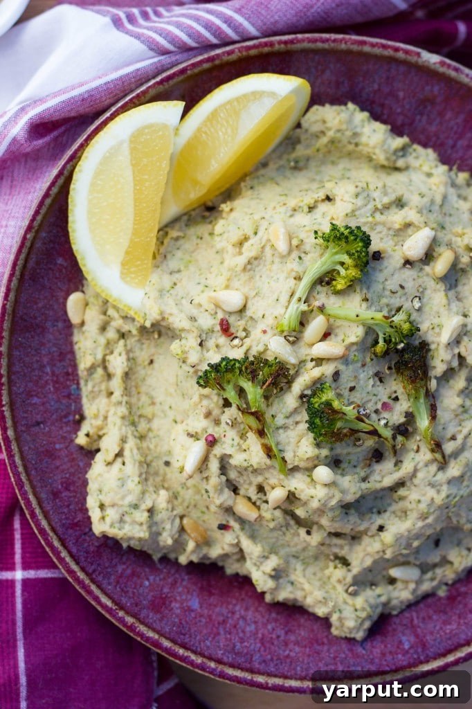 Roasted Broccoli & Lemon Hummus - A wide shot of the hummus bowl, perfect for a gathering.