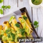 Baked Black Bean and Sweet Potato Taquitos with Roasted Tomatillo Avocado Dip
