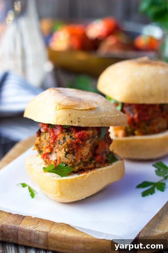 Plant-Powered Feta and Kale Sliders with White Beans 6 A serving of Vegetarian Meatball Sliders with fresh toppings on a rustic background