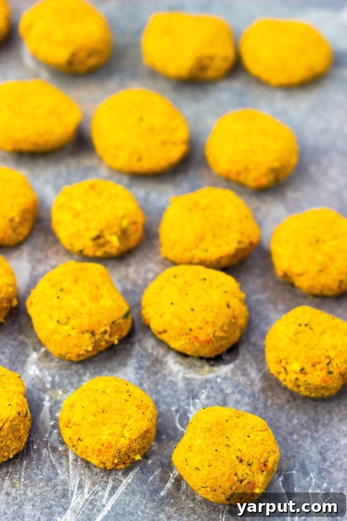 A fresh perspective on the Roasted Carrot Falafel, perfectly pan-fried to a golden crisp, ready to be added to a nutritious salad.