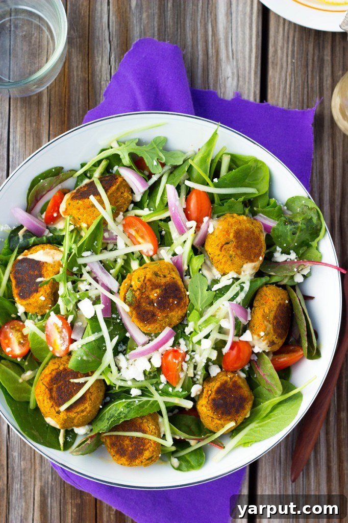 An overhead shot of the Roasted Carrot Falafel Salad, highlighting the colorful array of ingredients and the inviting texture of the falafel.