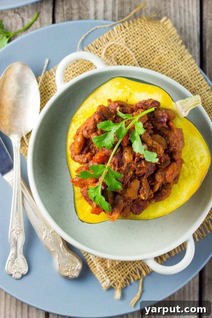 Three Chili Stuffed Acorn Squash on a baking sheet