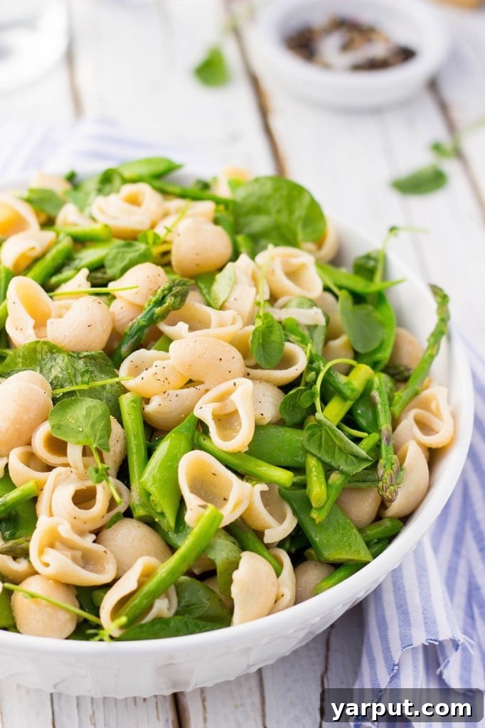 Vibrant Spring Pasta Medley 9 Another perspective of the Spring Pasta Salad, emphasizing the vibrant colors and fresh ingredients from a slightly elevated angle.