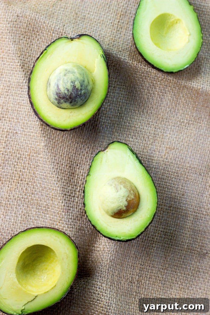 Moist and tender Avocado Chocolate Chip Pistachio Cookies cooling on a rack