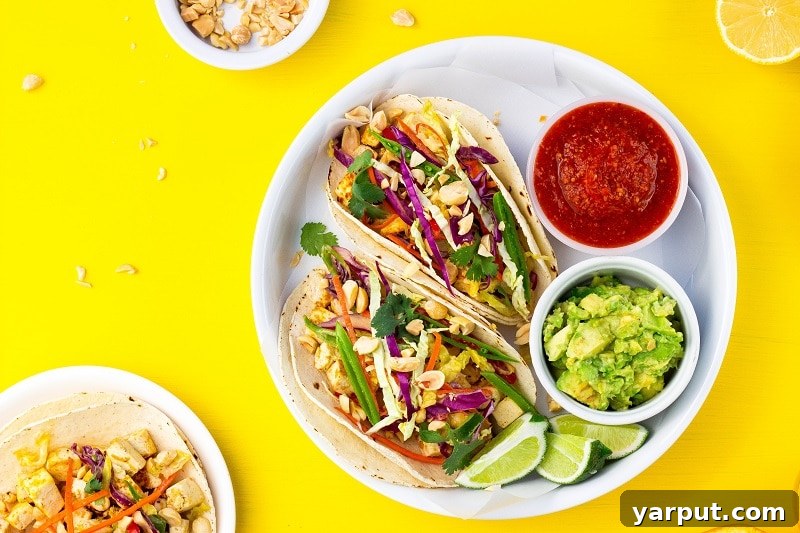 Tangy Umami Tofu Tacos 7 Close-up of a single Citrus Miso Tofu Taco with vibrant toppings