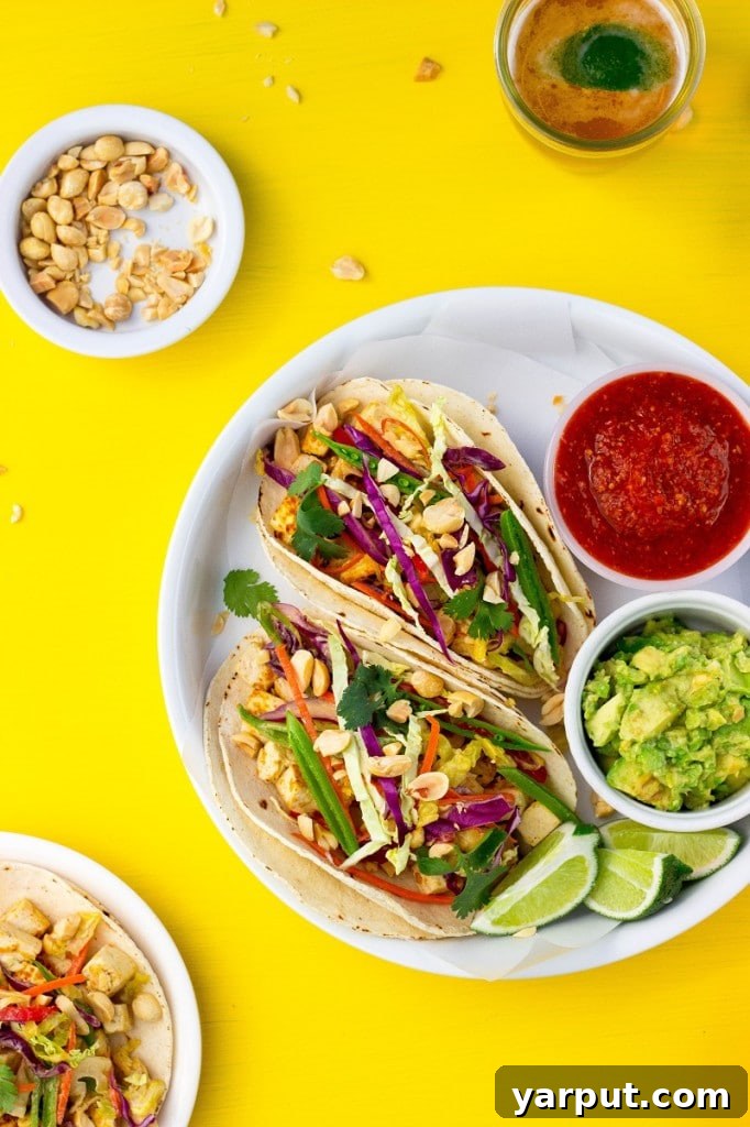 Tangy Umami Tofu Tacos 8 Stack of Citrus Miso Tofu Tacos on a wooden board