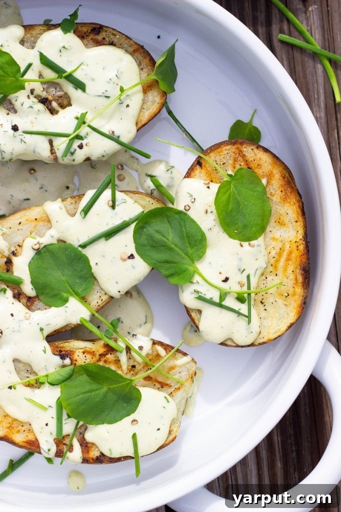 Grilled Potato halves with fresh watercress and chives.