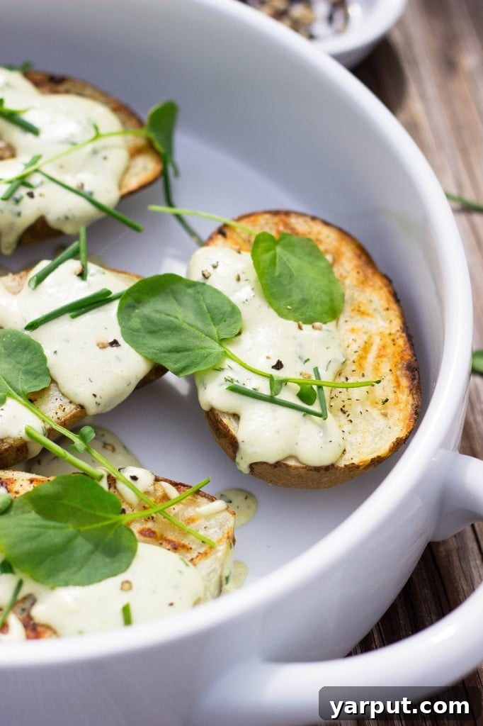 A plate of vegan grilled potatoes with ranch dressing.
