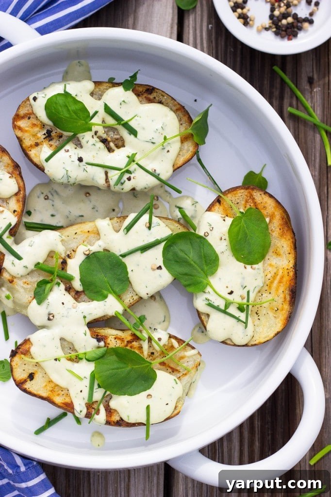Closeup of perfectly grilled potato showing char marks.