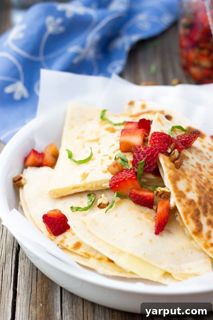 Brie and Strawberry Fusion Quesadillas 6 Brie Cheese Quesadillas with Strawberry Salsa served on a plate