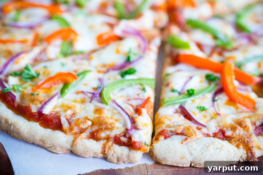 Simple and Delicious Gluten-Free Vegan Pizza Crust 6 Close up of a freshly baked gluten free pizza being sliced, highlighting the delicious toppings and the perfectly golden, chewy crust.
