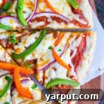 A close-up of the delicious gluten-free pizza crust, ready for toppings.